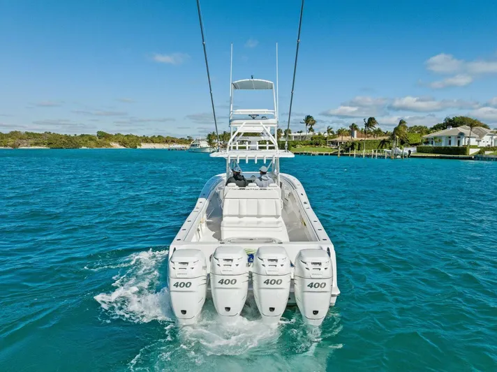 Ohana Yacht Photos Pics 2019 Invincible 42 Open Fisherman boat with quad 400 engines on blue water.