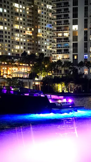 The Godfather Yacht Photos Pics VanDutch 55 yacht illuminated at night near city buildings, 2014 model.