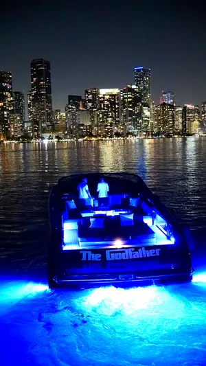 The Godfather Yacht Photos Pics VanDutch 55 yacht with blue lights, city skyline at night, 2014 model.