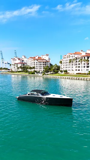 The Godfather Yacht Photos Pics 2014 VanDutch 55 yacht cruising in a scenic waterfront setting.