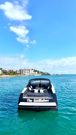 The Godfather Yacht Photos Pics VanDutch 55 yacht, 2014 model, named "The Godfather" on clear blue water.