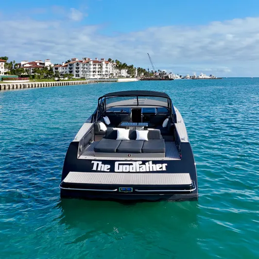 The Godfather Yacht Photos Pics VanDutch 55 yacht named "The Godfather" cruising in clear blue waters, 2014 model.