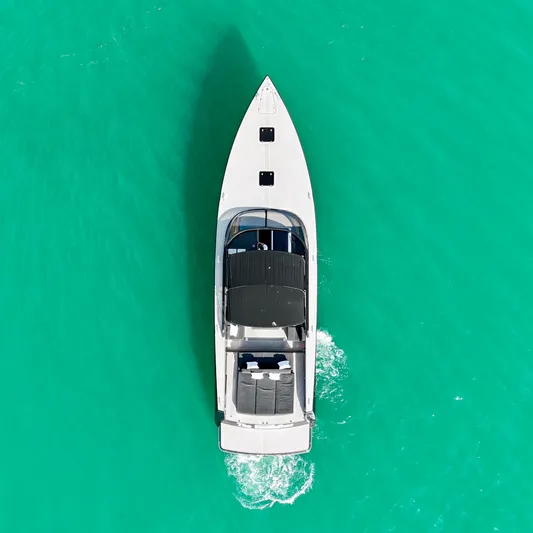 The Godfather Yacht Photos Pics Aerial view of 2014 VanDutch 55 yacht on turquoise water.