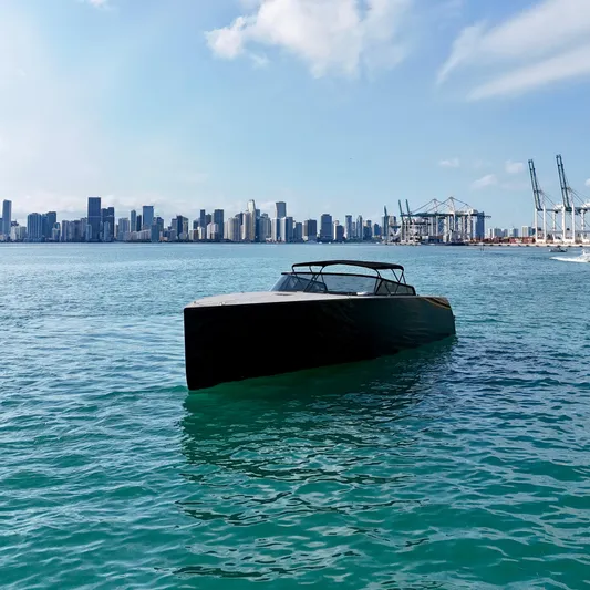 The Godfather Yacht Photos Pics VanDutch 55 yacht on water with city skyline in background, 2014 model.