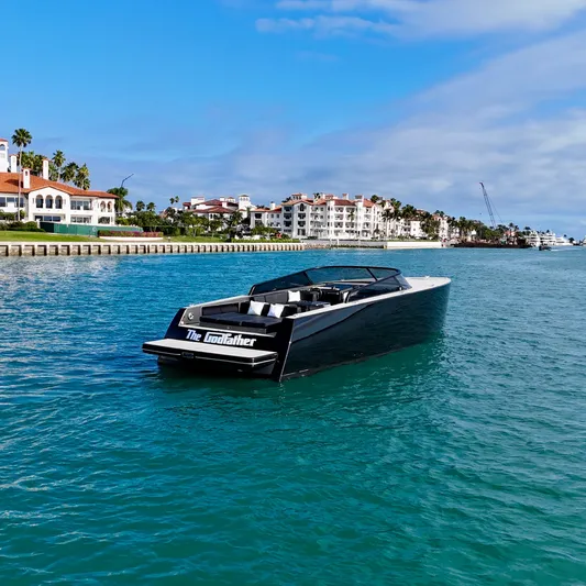 The Godfather Yacht Photos Pics 2014 VanDutch 55 yacht cruising near luxury waterfront homes.