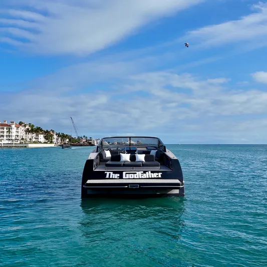 The Godfather Yacht Photos Pics VanDutch 55 yacht named "The Godfather" on serene blue waters, 2014 model.