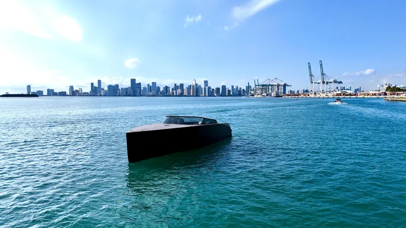 The Godfather Yacht Photos Pics VanDutch 55 yacht on blue water with city skyline in background, 2014 model.