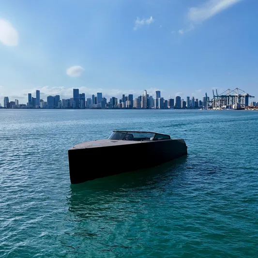 The Godfather Yacht Photos Pics VanDutch 55 yacht on water with city skyline in background, 2014 model.