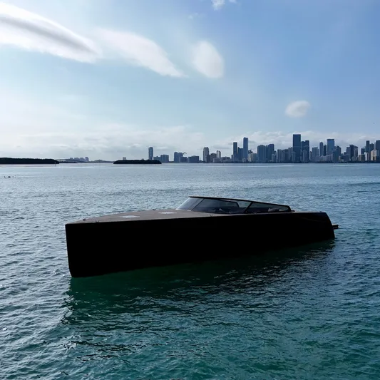 The Godfather Yacht Photos Pics VanDutch 55 yacht on water with city skyline in background, 2014 model.