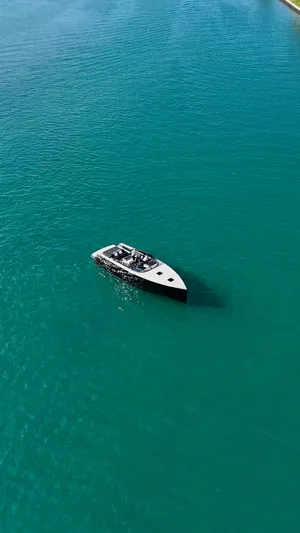 The Godfather Yacht Photos Pics Aerial view of 2014 VanDutch 55 yacht on turquoise water.