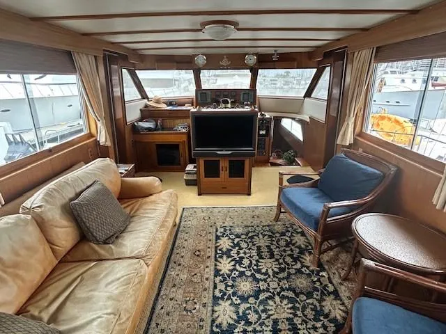 Day Light Yacht Photos Pics Interior of 1968 Hatteras 58 CPMY yacht with cozy seating and nautical decor.