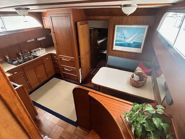 Day Light Yacht Photos Pics Interior of 1968 Hatteras 58 CPMY yacht with wood cabinetry and dining area.