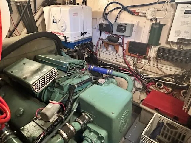 Day Light Yacht Photos Pics Engine room of 1968 Hatteras 58 CPMY with visible machinery and wiring.