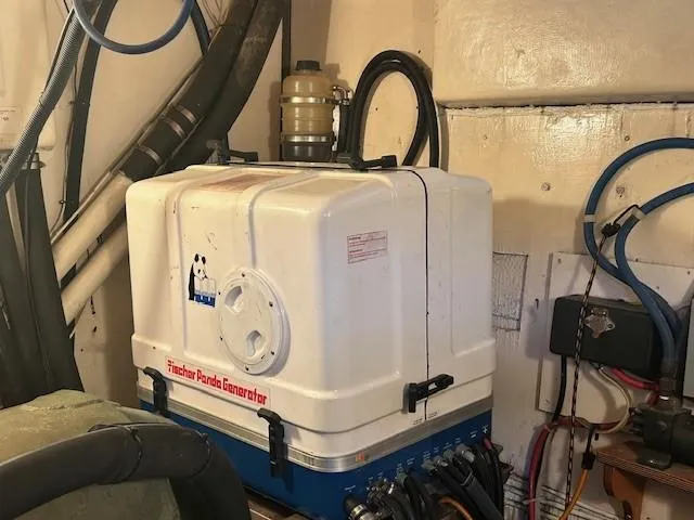 Day Light Yacht Photos Pics Engine room of 1968 Hatteras 58 CPMY with Fischer Panda generator.