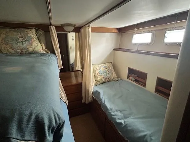 Day Light Yacht Photos Pics Cozy cabin interior of 1968 Hatteras 58 CPMY yacht with twin beds and nautical decor.