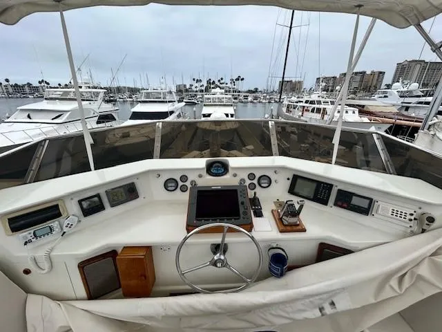 Day Light Yacht Photos Pics Helm of 1968 Hatteras 58 CPMY yacht with marina view.