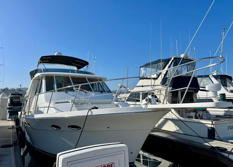 Mamba Mentality Yacht Photos Pics 2008 Meridian 490 Pilothouse yacht docked at marina under clear blue sky.