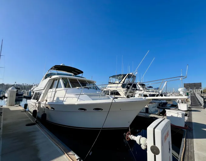 Mamba Mentality Yacht Photos Pics 2008 Meridian 490 Pilothouse yacht docked at marina under clear blue sky.