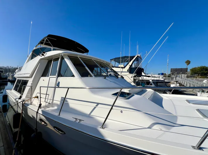 Mamba Mentality Yacht Photos Pics 2008 Meridian 490 Pilothouse yacht docked under clear blue sky.