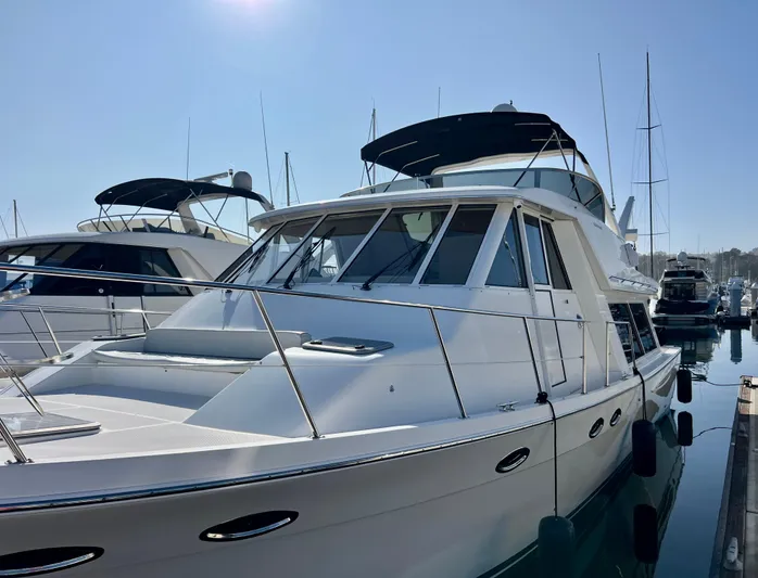 Mamba Mentality Yacht Photos Pics 2008 Meridian 490 Pilothouse yacht docked in marina under clear sky.