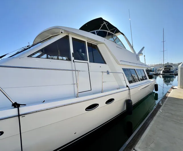 Mamba Mentality Yacht Photos Pics 2008 Meridian 490 Pilothouse yacht docked at marina under clear sky.