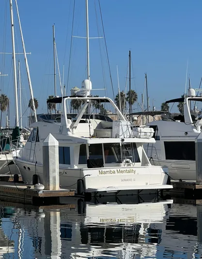 Mamba Mentality Yacht Photos Pics 2008 Meridian 490 Pilothouse yacht docked in a marina.