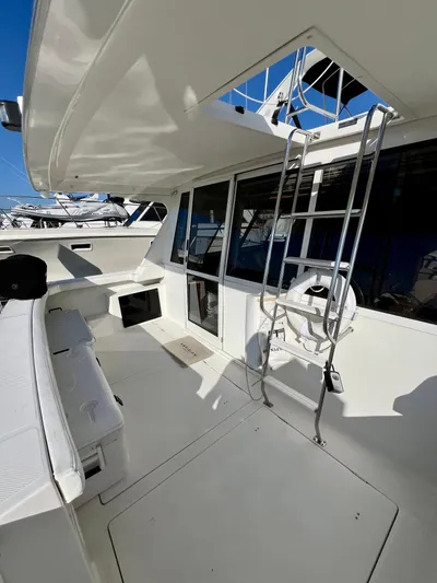 Mamba Mentality Yacht Photos Pics 2008 Meridian 490 Pilothouse yacht deck with ladder and seating area.