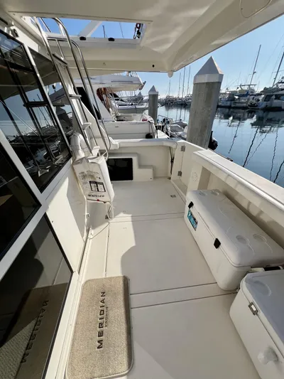 Mamba Mentality Yacht Photos Pics 2008 Meridian 490 Pilothouse yacht deck with marina view.