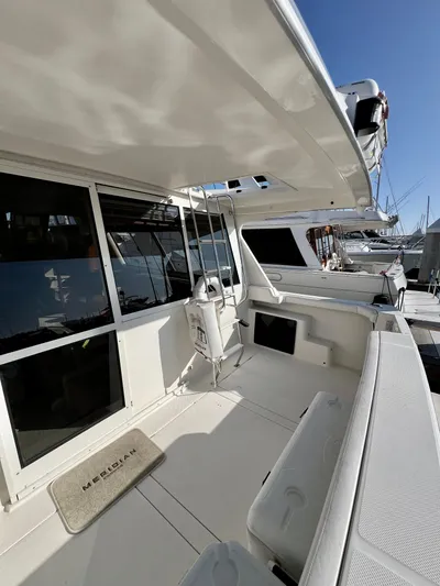 Mamba Mentality Yacht Photos Pics 2008 Meridian 490 Pilothouse yacht deck with seating and helm station.