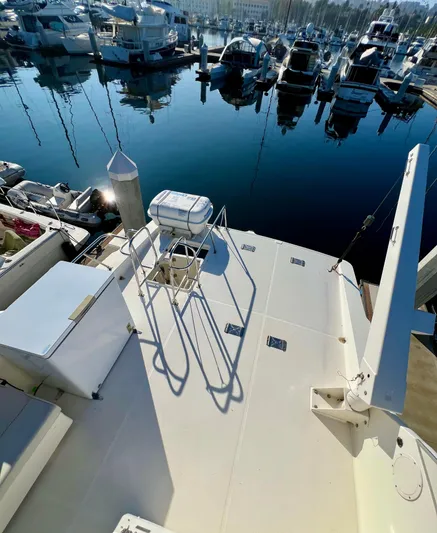 Mamba Mentality Yacht Photos Pics 2008 Meridian 490 Pilothouse yacht docked in a marina, surrounded by other boats.