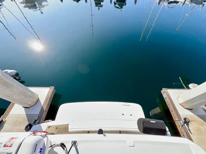 Mamba Mentality Yacht Photos Pics Meridian 490 Pilothouse 2008 docked at marina, reflecting calm water and clear sky.