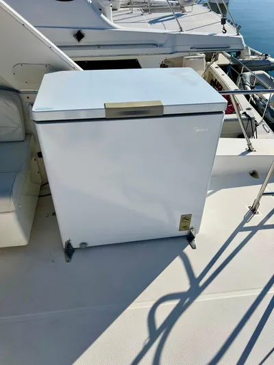 Mamba Mentality Yacht Photos Pics White chest freezer on 2008 Meridian 490 Pilothouse yacht deck.