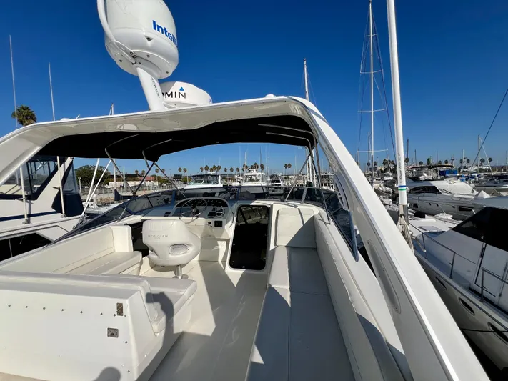 Mamba Mentality Yacht Photos Pics 2008 Meridian 490 Pilothouse yacht docked at marina under clear blue sky.