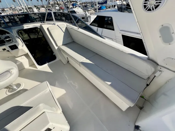 Mamba Mentality Yacht Photos Pics 2008 Meridian 490 Pilothouse yacht interior with white seating and helm station.