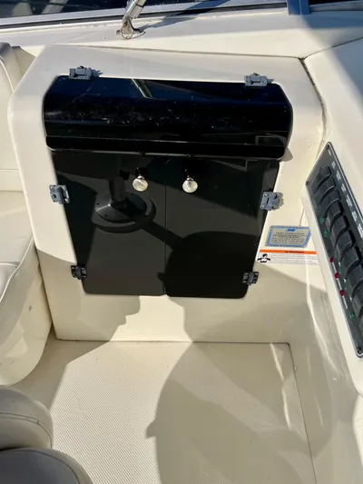 Mamba Mentality Yacht Photos Pics 2008 Meridian 490 Pilothouse interior, featuring control panel and storage compartment.