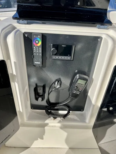 Mamba Mentality Yacht Photos Pics Control panel of 2008 Meridian 490 Pilothouse with remote and communication devices.