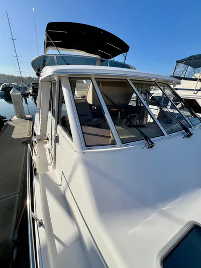 Mamba Mentality Yacht Photos Pics 2008 Meridian 490 Pilothouse yacht docked at marina under clear blue sky.