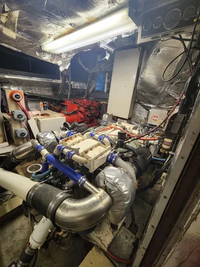  Yacht Photos Pics 1984 Infinity Express engine room with complex machinery and wiring.