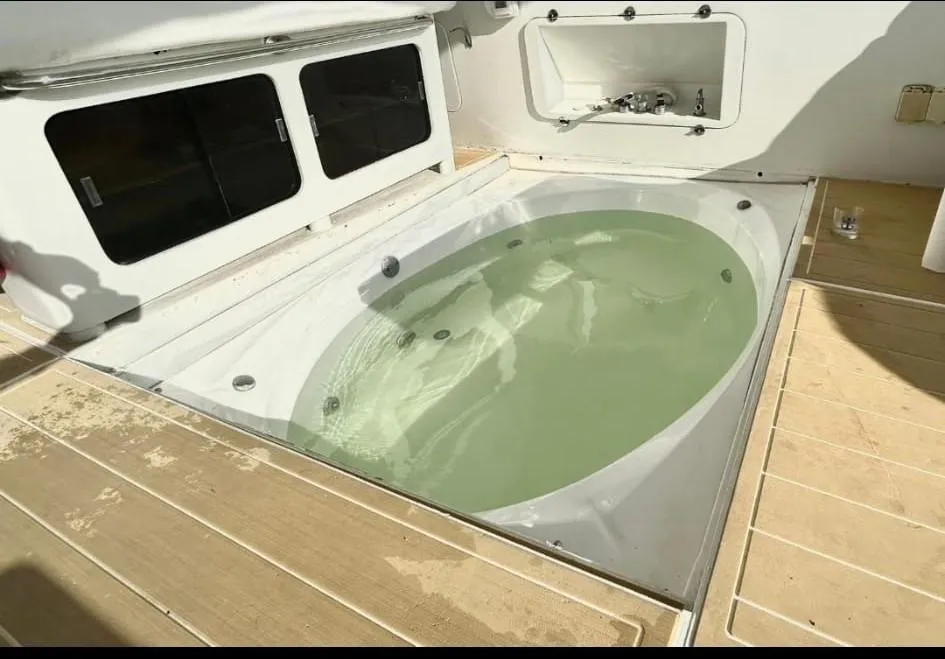 Built-in hot tub on the deck of a 1984 Infinity Express boat.