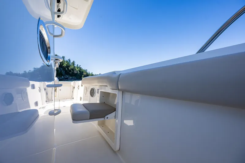  Yacht Photos Pics 2017 Boston Whaler 330 Outrage interior with seating, blue sky, and water view.