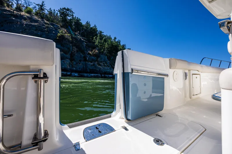  Yacht Photos Pics Boston Whaler 330 Outrage 2017 boat interior with open door, scenic water view.