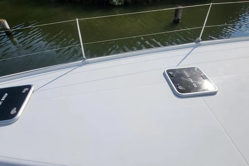 Knot On Call Yacht Photos Pics Deck of 2018 Fountaine Pajot Helia 44 catamaran with hatches and railing.