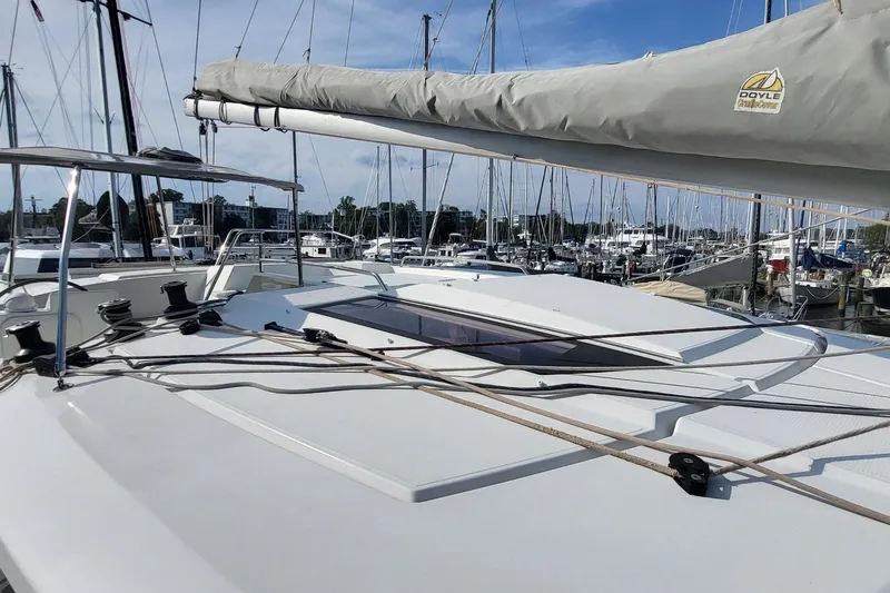 Knot On Call Yacht Photos Pics 2018 Fountaine Pajot Helia 44 catamaran docked at a marina, showcasing deck and rigging.
