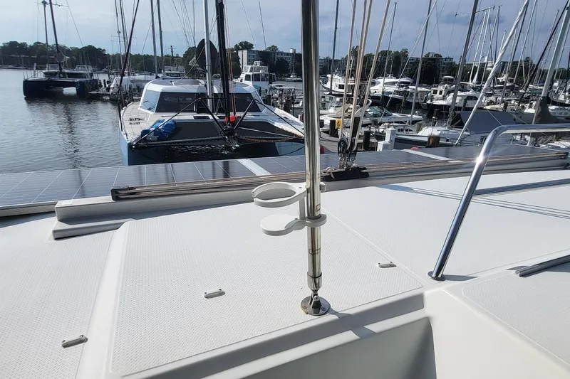 Knot On Call Yacht Photos Pics 2018 Fountaine Pajot Helia 44 catamaran docked at marina with solar panels.