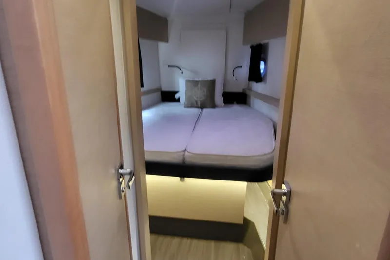 Knot On Call Yacht Photos Pics Cabin interior of 2018 Fountaine Pajot Helia 44 catamaran with cozy bed and ambient lighting.