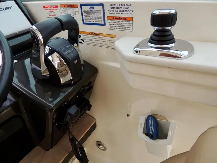  Yacht Photos Pics Control panel of a 2016 Sea Ray 350 Sundancer boat with throttle and joystick.