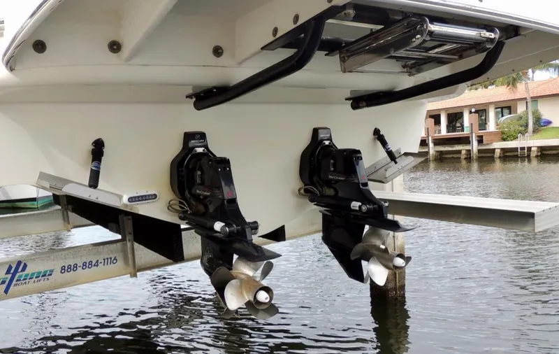  Yacht Photos Pics 2016 Sea Ray 350 Sundancer boat stern with dual propellers in marina.