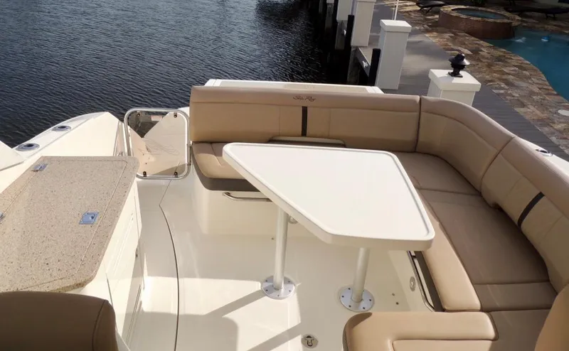  Yacht Photos Pics 2016 Sea Ray 350 Sundancer boat with spacious seating and table on deck.