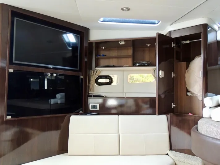  Yacht Photos Pics Interior of 2016 Sea Ray 350 Sundancer with TV, cabinets, and seating.