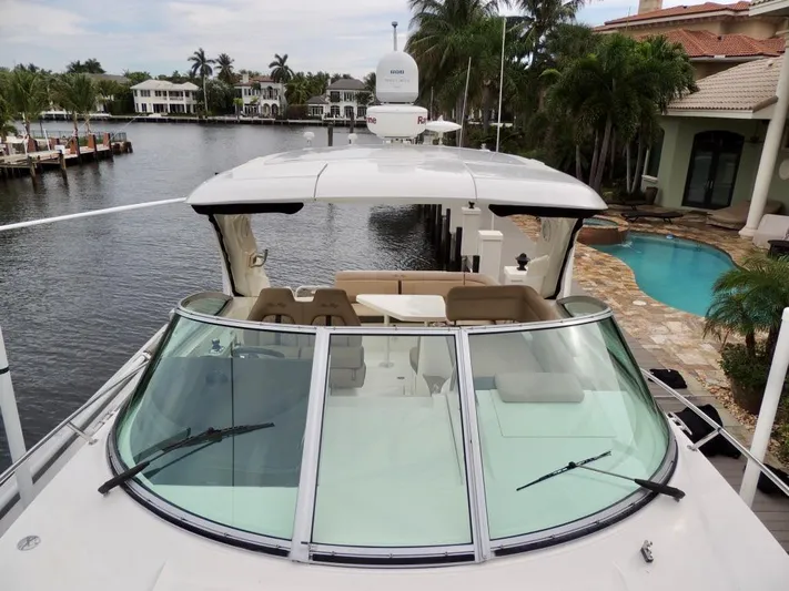  Yacht Photos Pics 2016 Sea Ray 350 Sundancer yacht docked by waterfront homes.